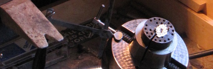 Jeweler creating a sapphire piece